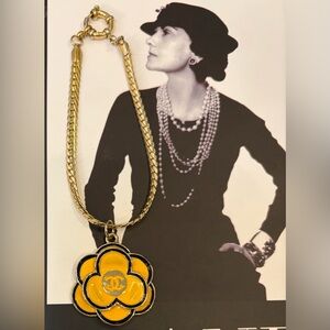 CHANEL Gold-Tone Bracelet with Yellow Camellia Pendant
Stamped authentic Chanel